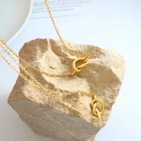 HKM-952915 Wholesale Women Jewelry 18k Gold Plated Stainless Steel Tie Heart Pendant Love Knot Necklace