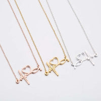 HKM-412819 Trendy Golden Clavicle Chain Necklace Heart Pendant Necklace Stethoscope Heartbeat Necklace for Women