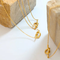HKM-952915 Wholesale Women Jewelry 18k Gold Plated Stainless Steel Tie Heart Pendant Love Knot Necklace