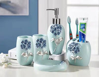 HKM-497491 Flower Pattern Polyresin Bathroom Accessory Set in Blue - Includes Lotion Dispenser, Toothbrush Holder, Soap Dish, Tumbler, Toilet Brush Holder, Amenity Tray, Tissue Cover, and Waste Bin