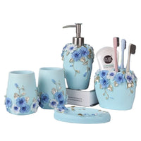 HKM-497491 Flower Pattern Polyresin Bathroom Accessory Set in Blue - Includes Lotion Dispenser, Toothbrush Holder, Soap Dish, Tumbler, Toilet Brush Holder, Amenity Tray, Tissue Cover, and Waste Bin