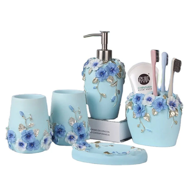 HKM-497491 Flower Pattern Polyresin Bathroom Accessory Set in Blue - Includes Lotion Dispenser, Toothbrush Holder, Soap Dish, Tumbler, Toilet Brush Holder, Amenity Tray, Tissue Cover, and Waste Bin