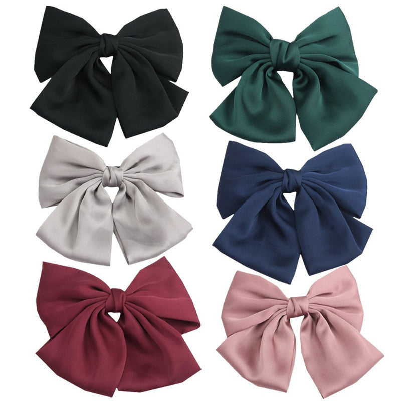 HKM-682899 Elegant Bow Hair Clip in Tribute Silk with Alloy Detailing and Elastic Band, Perfect for Special Occasions