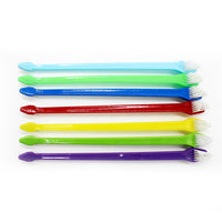 HKM-8751933 Nylon Bristle Dog Toothbrush with Plastic Handle and Paw Print Design
