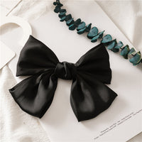 HKM-682899 Elegant Bow Hair Clip in Tribute Silk with Alloy Detailing and Elastic Band, Perfect for Special Occasions