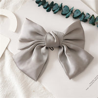 HKM-682899 Elegant Bow Hair Clip in Tribute Silk with Alloy Detailing and Elastic Band, Perfect for Special Occasions