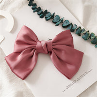 HKM-682899 Elegant Bow Hair Clip in Tribute Silk with Alloy Detailing and Elastic Band, Perfect for Special Occasions