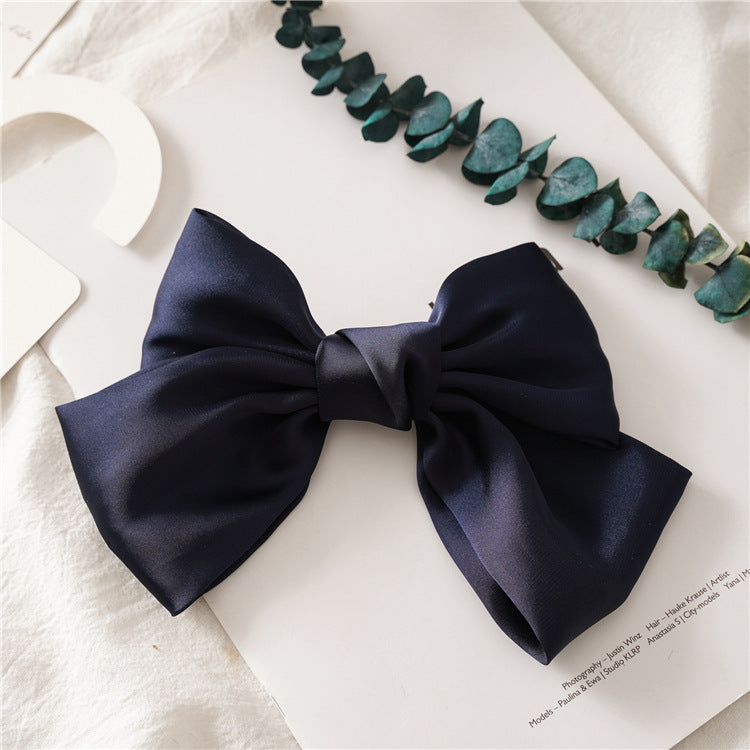 HKM-682899 Elegant Bow Hair Clip in Tribute Silk with Alloy Detailing and Elastic Band, Perfect for Special Occasions