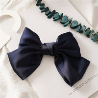 HKM-682899 Elegant Bow Hair Clip in Tribute Silk with Alloy Detailing and Elastic Band, Perfect for Special Occasions
