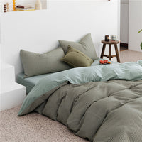 HKM-085907 Cotton Knitted Four-Piece Bedding Set with Geometric Patterns in Various Colors