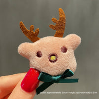 HKM-259411 Christmas Cartoon Character Brooch Decoration with Snowflake Design