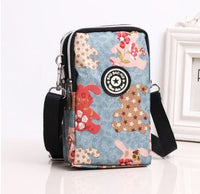 HKM-767379 Stylish Vertical Mobile Phone Bag with Zipper Closure and Vibrant Print Designs
