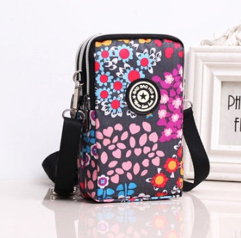 HKM-767379 Stylish Vertical Mobile Phone Bag with Zipper Closure and Vibrant Print Designs