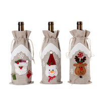 HKM-780243 Linen Christmas Wine Bottle Covers - Set of 3 Santa, Deer, and Snowman Designs
