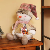 HKM-795859 Santa Claus Plush Toy with LED Lighting and Snow Scene Decoration for Holiday Festivities